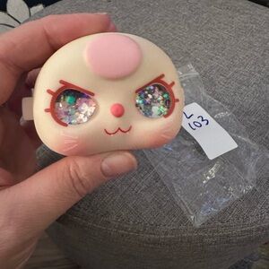 Baby Three 100% face with black background and bow/ribbon glitter